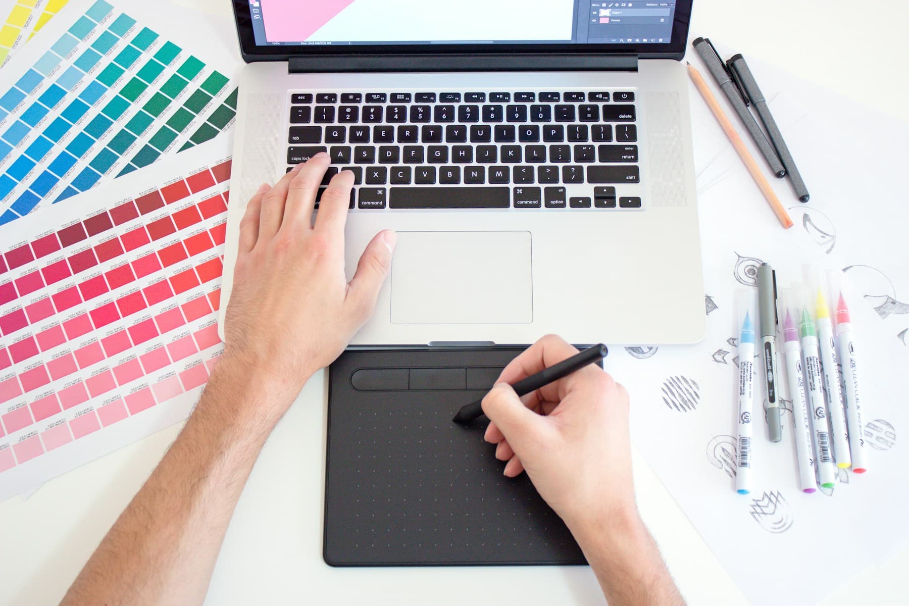 Designer working with a graphics tablet and color system
