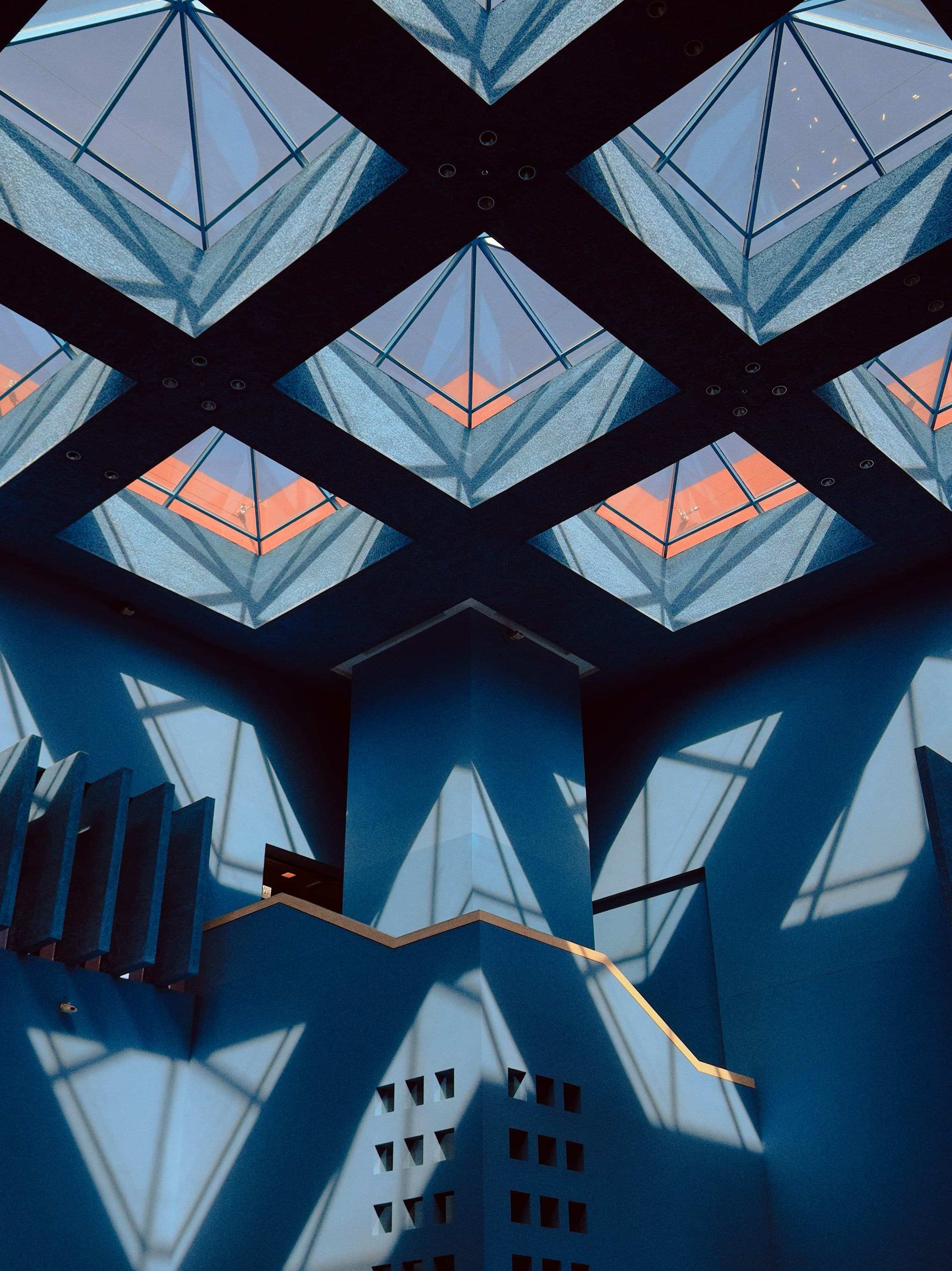 Geometric blue architectural interior photographed by Jason Leung